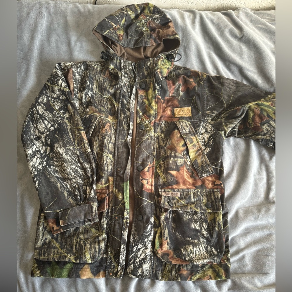 Game Winner waterproof camo jacket. Boys size medium.
